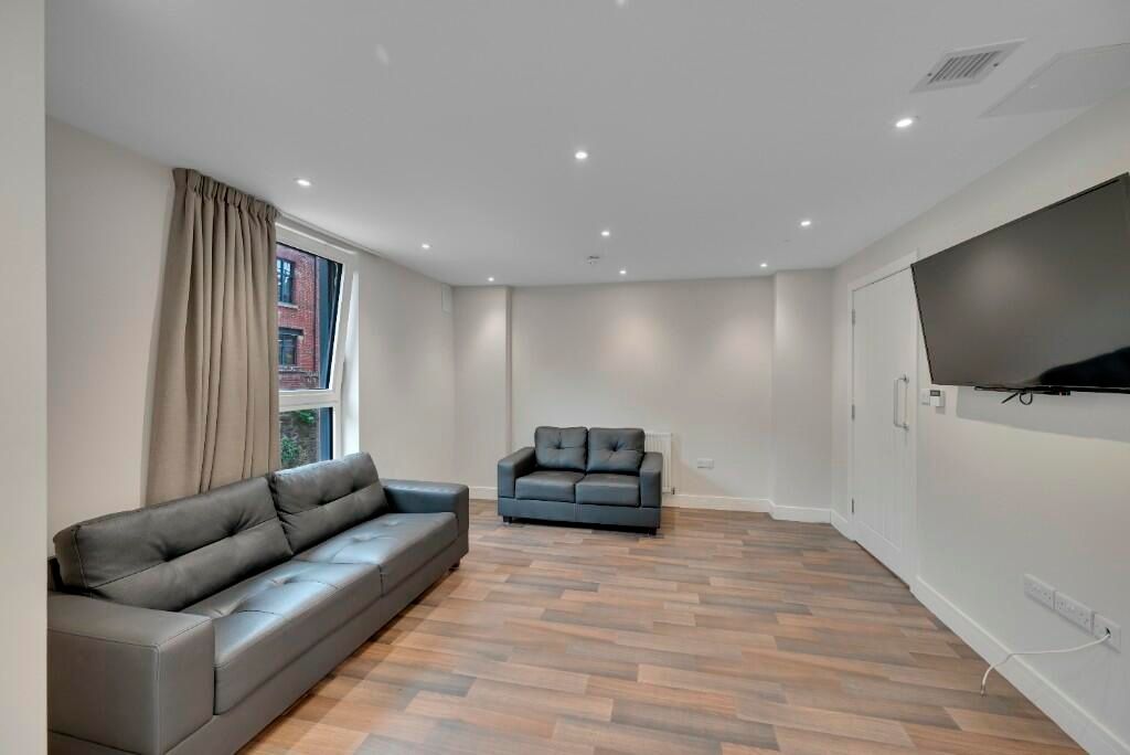 Property photo 3 of 15 A Modern Living Room Featuring Two Comfortable Sof...