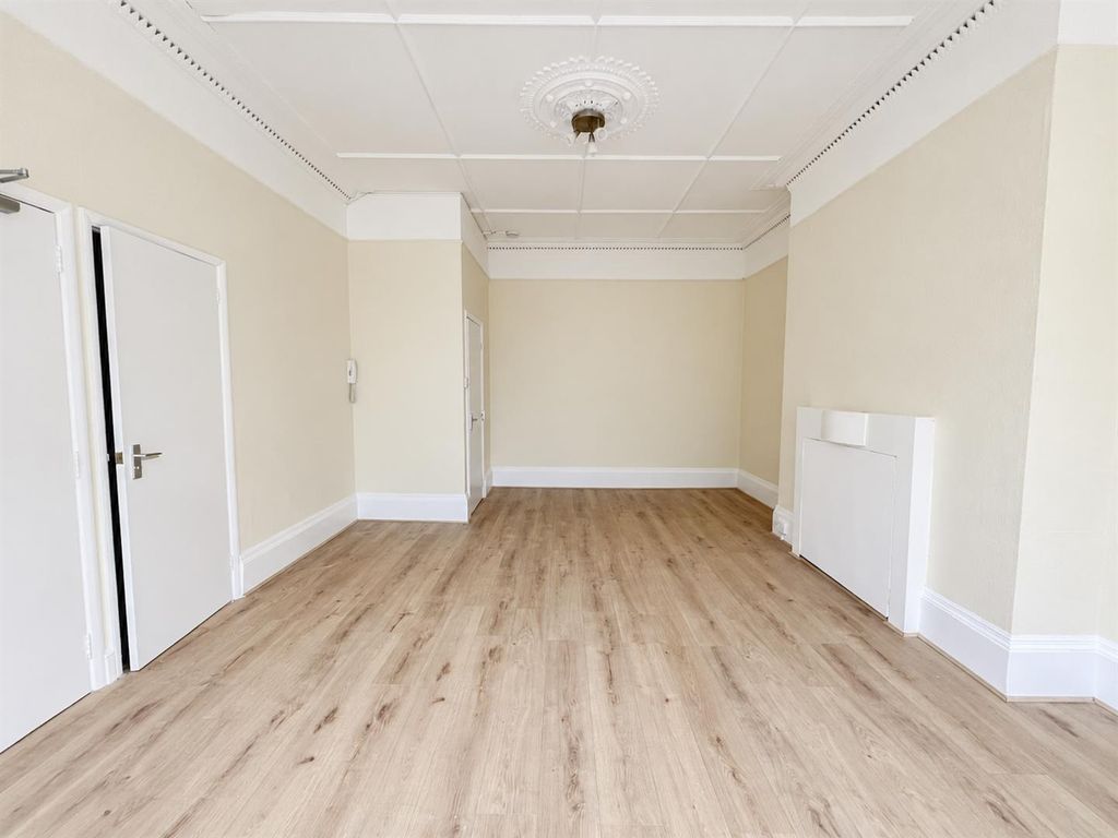 Property photo 3 of 13 Empty Cream Room With Ornate Ceiling Details.Jpg