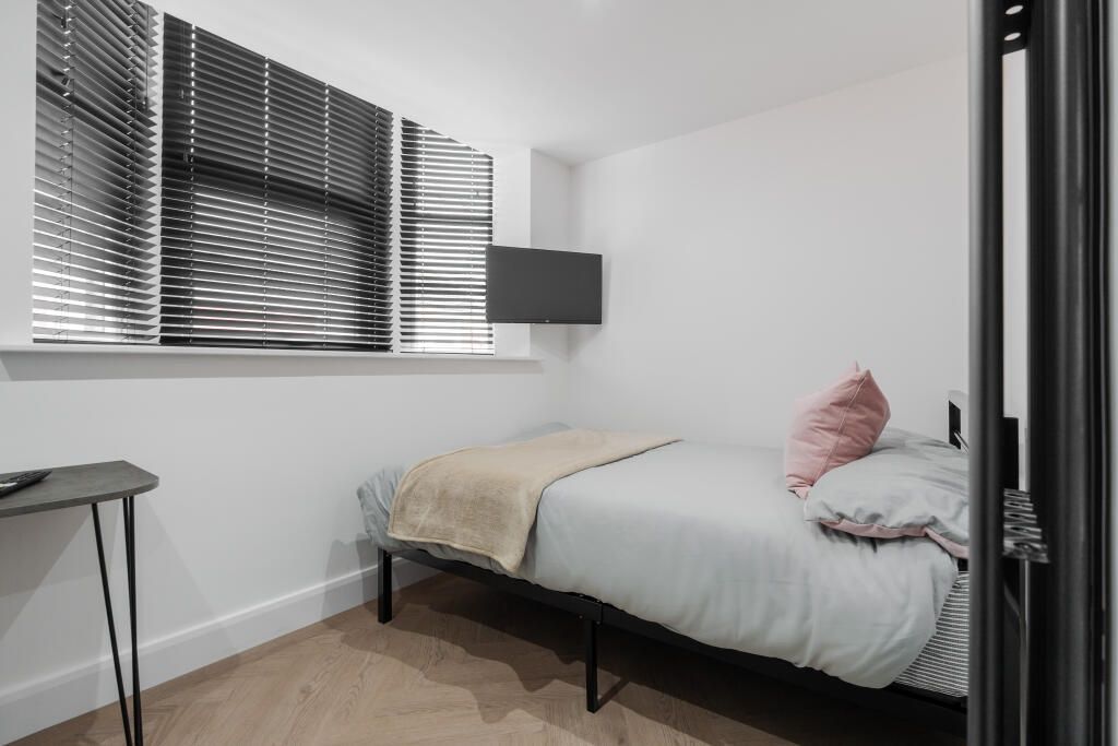 Property photo 3 of 13 A Clean And Cozy Single Bedroom With A Neatly Made...