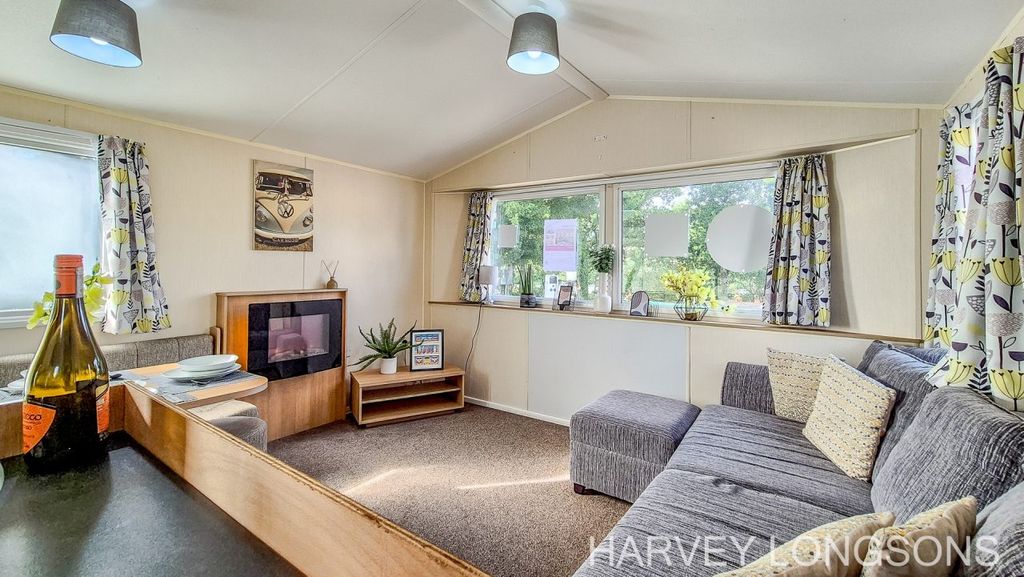 Property photo 3 of 18 Spacious Lounge With Large Windows And Sofa