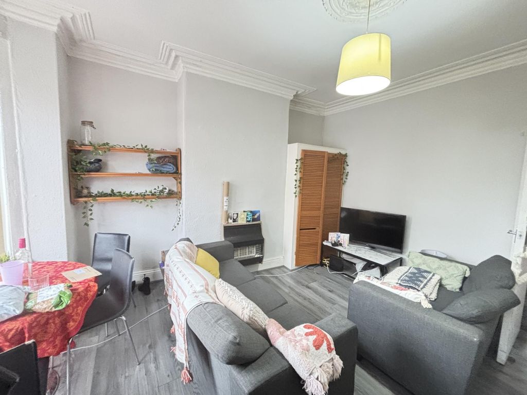 Property photo 2 of 26 Bright And Welcoming Living Room Featuring Comfort...