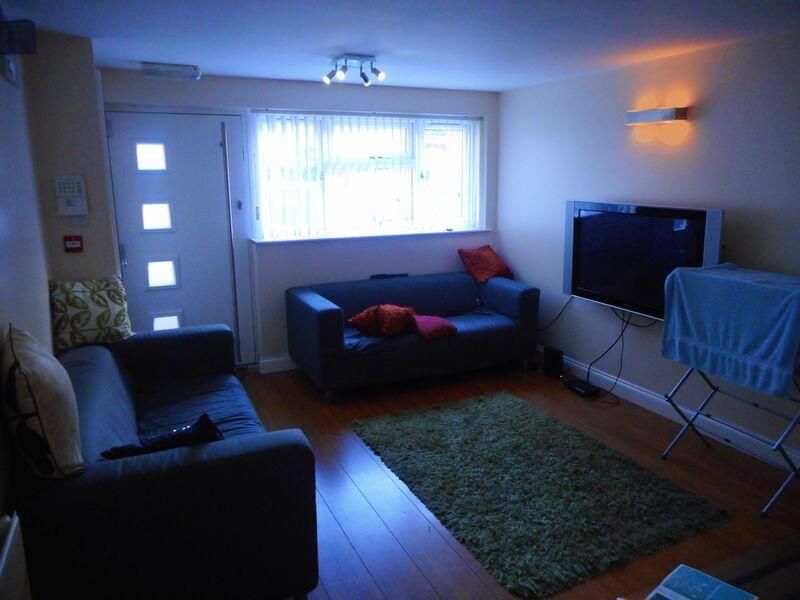 Property photo 1 of 10 Bright And Inviting Living Room Featuring Comforta...