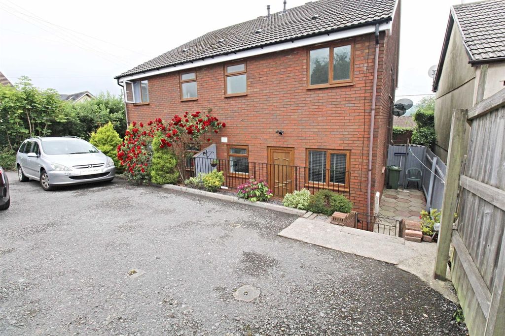 Property photo 3 of 12 Paved Patio & Parking