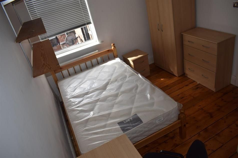 Property photo 3 of 13 Bright, Simply Furnished Bedroom With Wooden Floor...
