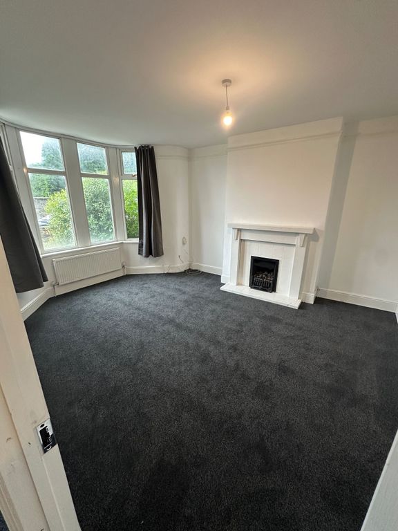 Property photo 3 of 17 A Bright And Inviting Living Room Featuring A Larg...