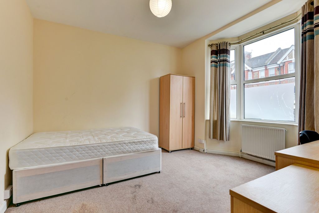 Property photo 3 of 11 A Bright And Tidy Bedroom Featuring A Comfortable ...