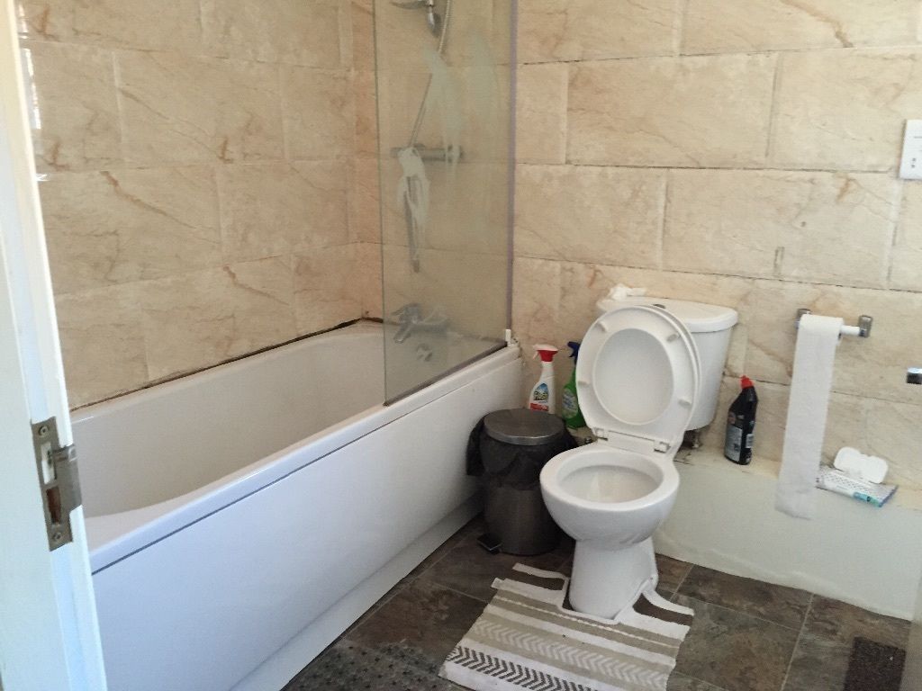 Property photo 3 of 12 Well-Kept Bathroom With A Full Bathtub And Glass S...