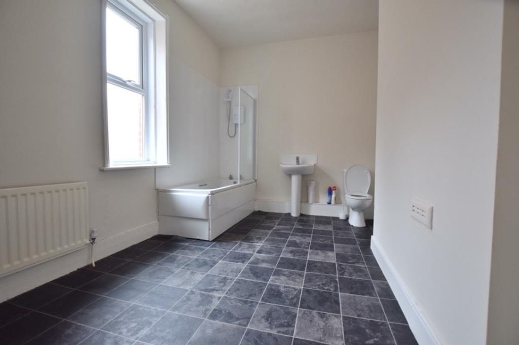 Property photo 2 of 7 A Spacious And Bright Bathroom Featuring Both A Ba...