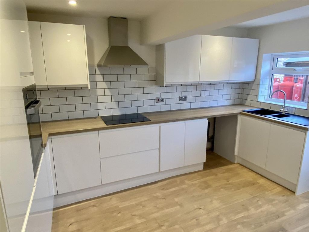 Property photo 3 of 9 Modern Kitchen With Sleek Gloss Cabinetry And Tili...