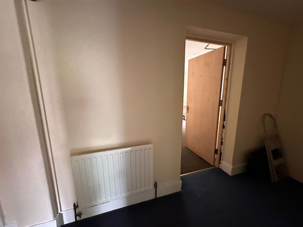 Property photo 3 of 18 A Clean And Simple Hallway With A White Radiator A...