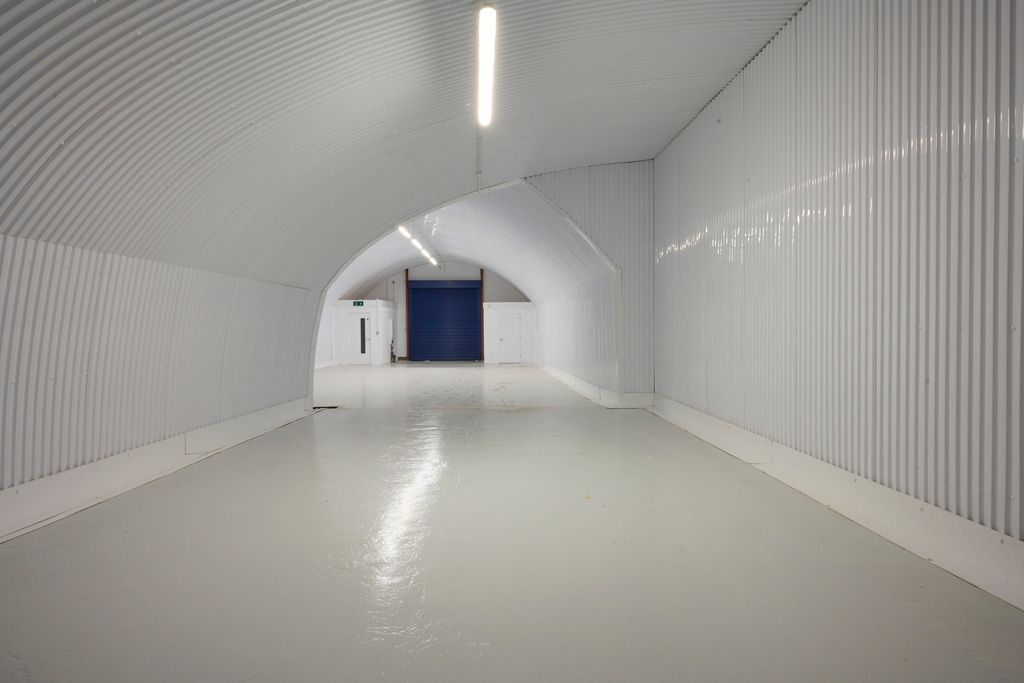 Property photo 1 of 3 An Empty Arch With Lining, Facing The Front Electric Roller Shutter Entrance, Which Is Closed.