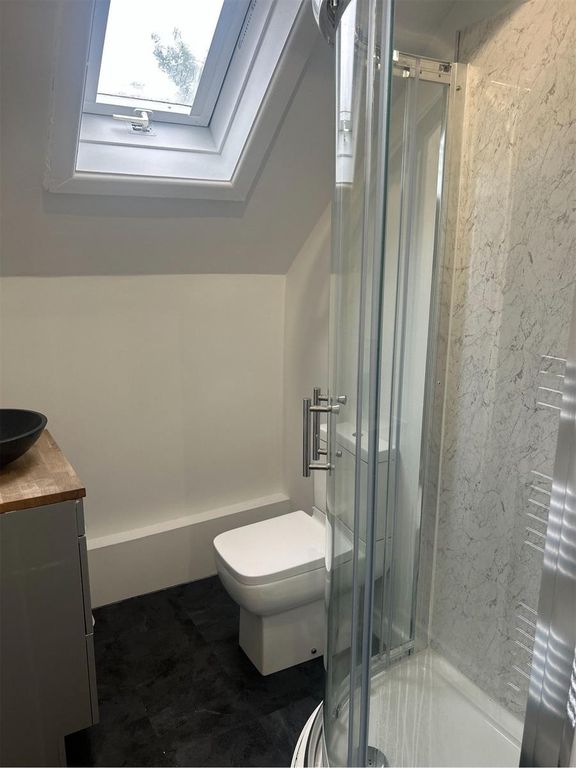 Property photo 3 of 5 A Bright And Clean Bathroom Featuring A Modern Sho...