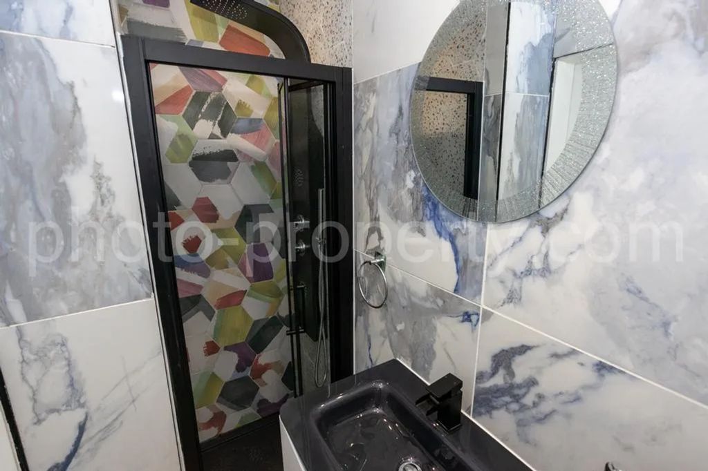 Property photo 2 of 12 A Beautifully Designed Bathroom Featuring Stylish ...