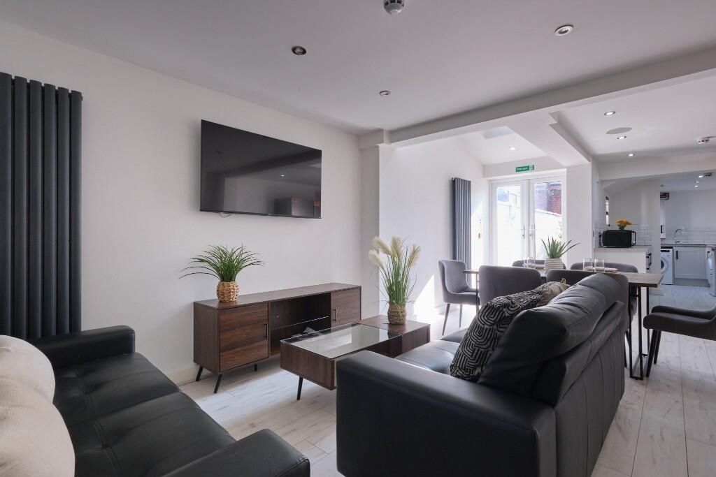 Property photo 2 of 15 A Spacious, Modern Living Room Filled With Natural...