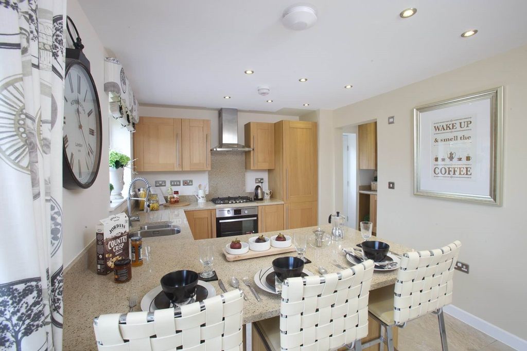 Property photo 2 of 14 The Kitchen Features A Breakfast Bar, Perfect For A Quick Bite