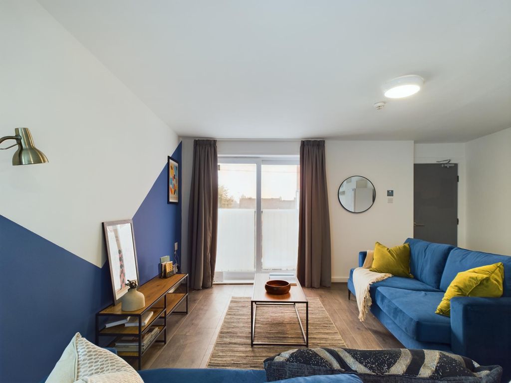 Property photo 2 of 41 A Bright And Inviting Living Room Featuring Comfor...