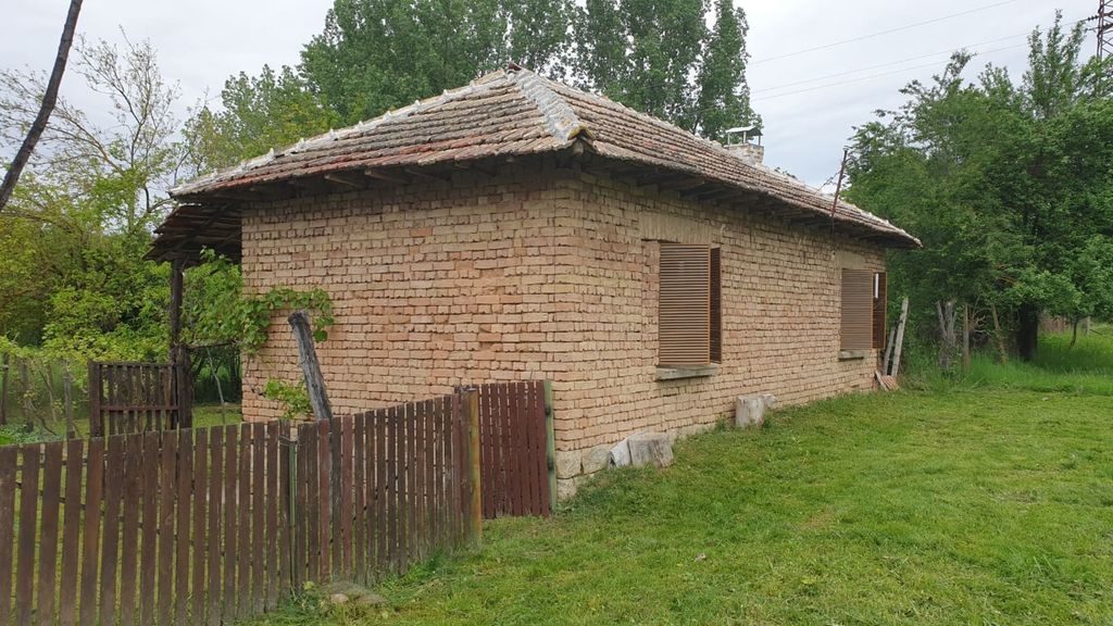 Property photo 2 of 50 Side Perspective Showing Brick Walls, Wooden Shutters, And A Wooden Fence Enclosing Part Of The Garden