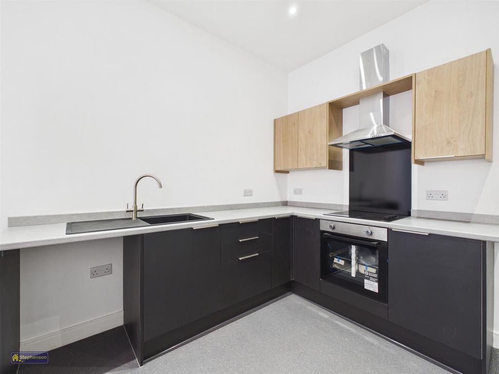 Property photo 2 of 8 Kitchen Area