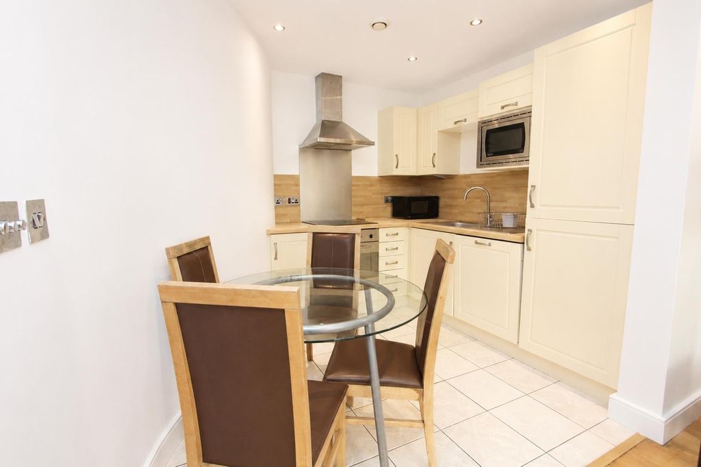 Property photo 2 of 12 Modern Kitchen With Stylish Glass Dining Table...