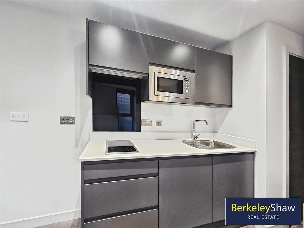 Property photo 2 of 8 Kitchen Area