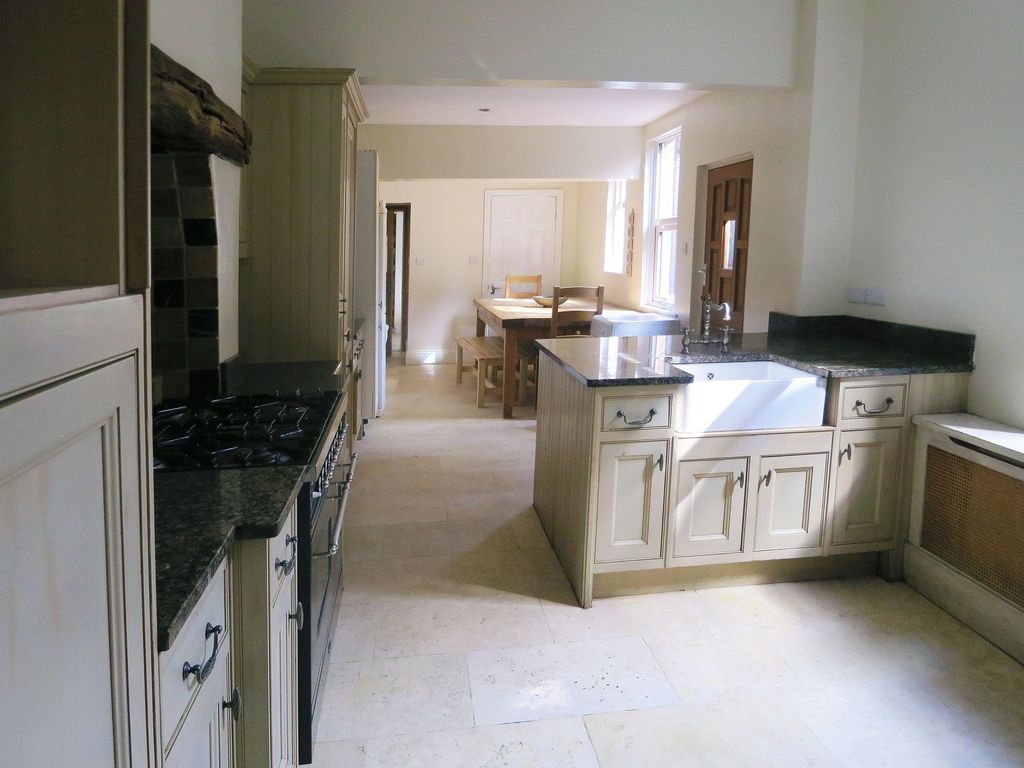 Property photo 2 of 28 Bright And Inviting Kitchen With Ample Cabinetry, ...