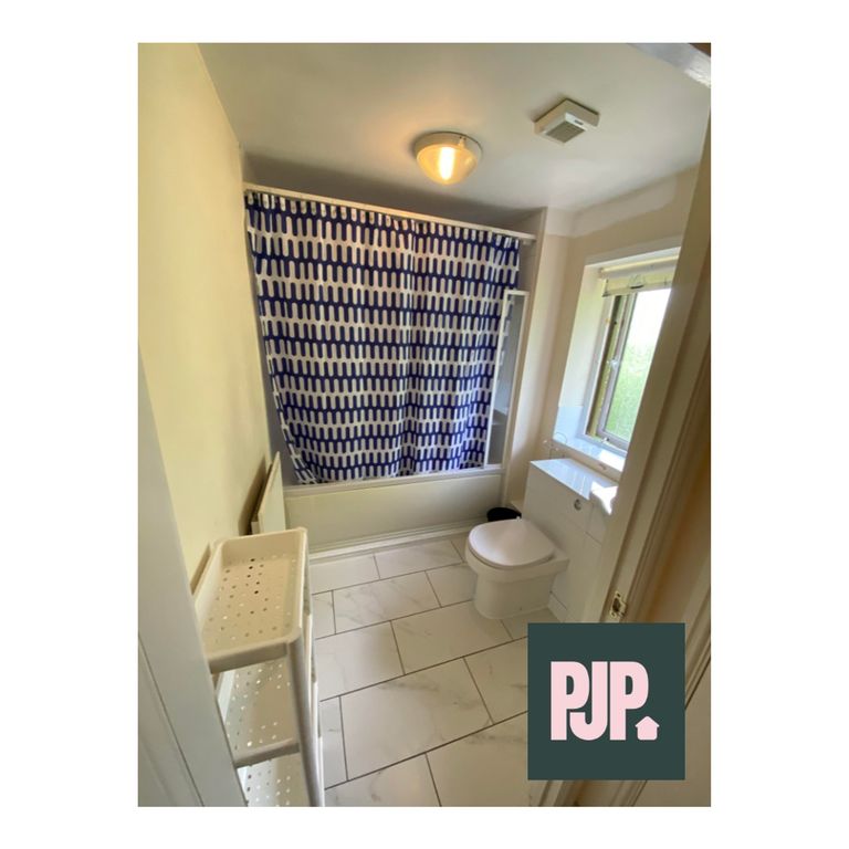 Property photo 3 of 6 A Bright And Clean Bathroom Featuring Modern Fixtu...