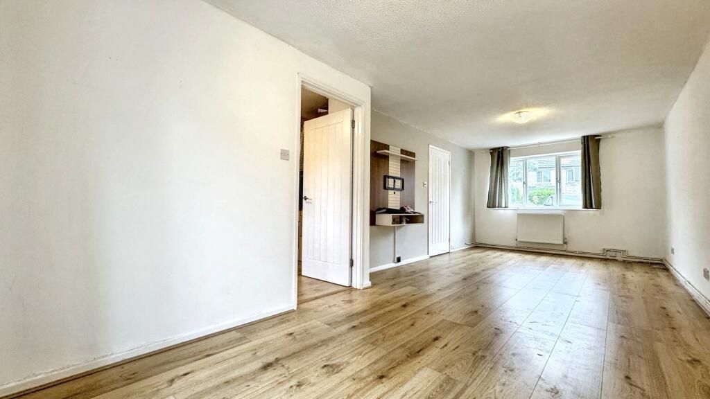 Property photo 3 of 14 Bright And Spacious Living Room Featuring Contempo...