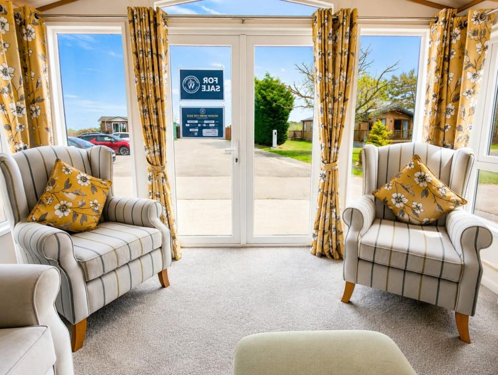 Property photo 2 of 6 Front Lounge With Two Armchairs And Patio Doors Overlooking The Park