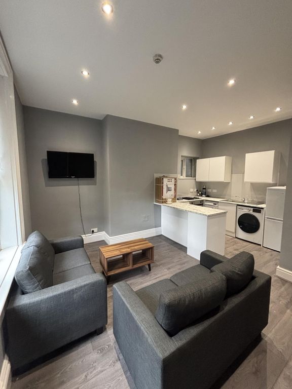 Property photo 1 of 28 Modern And Stylish Living Room Featuring A Comfort...