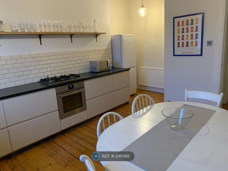 Property photo 2 of 11 Kitchen With Dining Table