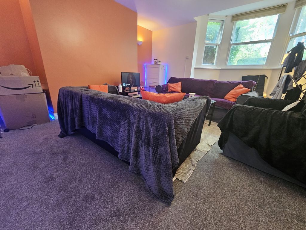 Property photo 2 of 10 A Cozy Living Room Featuring A Comfortable Seating...