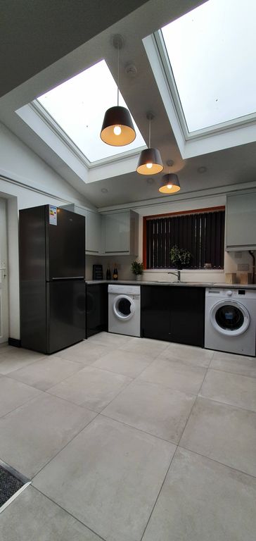 Property photo 2 of 6 Modern Kitchen Featuring Sleek Appliances And Ampl...