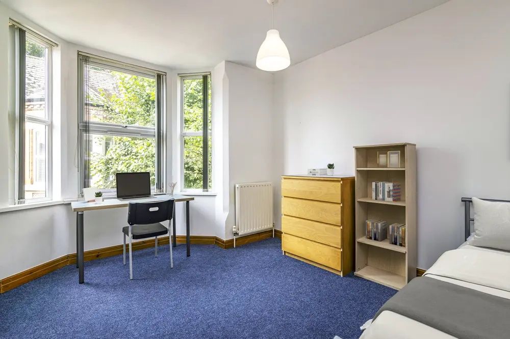Property photo 3 of 8 Bright And Airy Bedroom Featuring A Large Bay Wind...