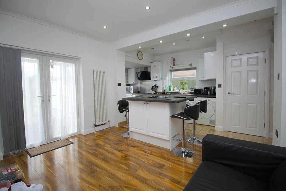 Property photo 3 of 22 Living Area Through Kitchen