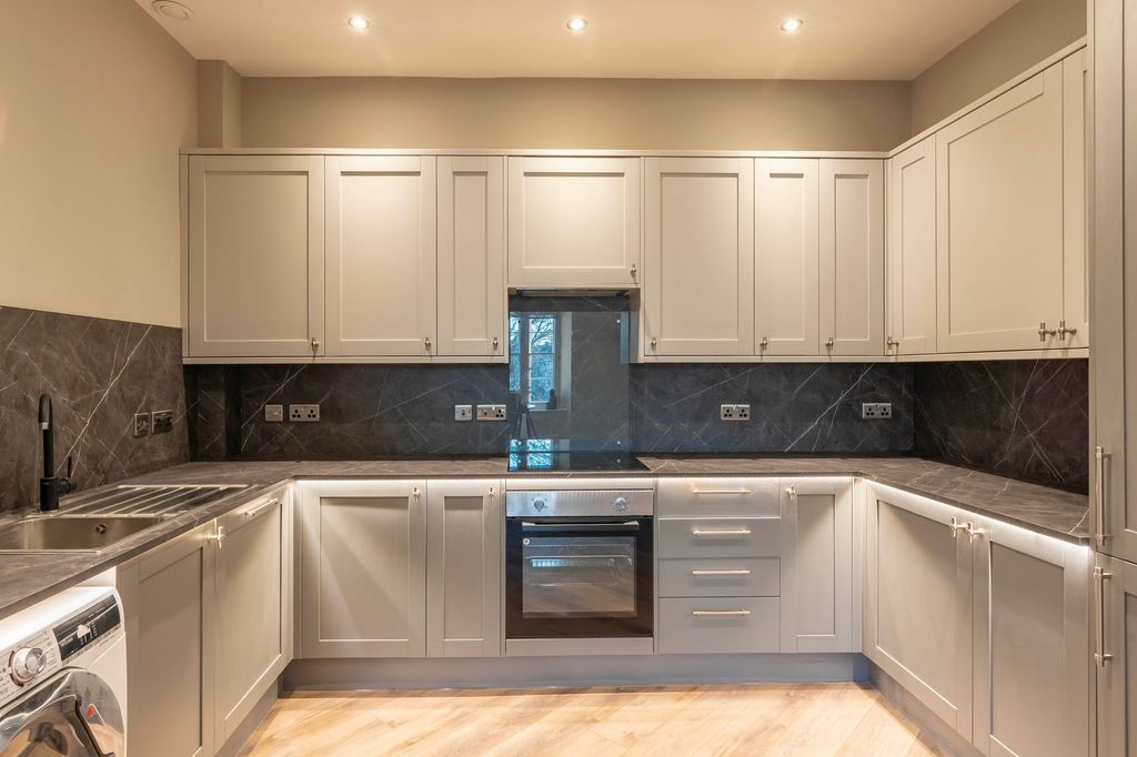 Property photo 3 of 7 Modern U-Shaped Kitchen With Grey Shaker Cabinetry...