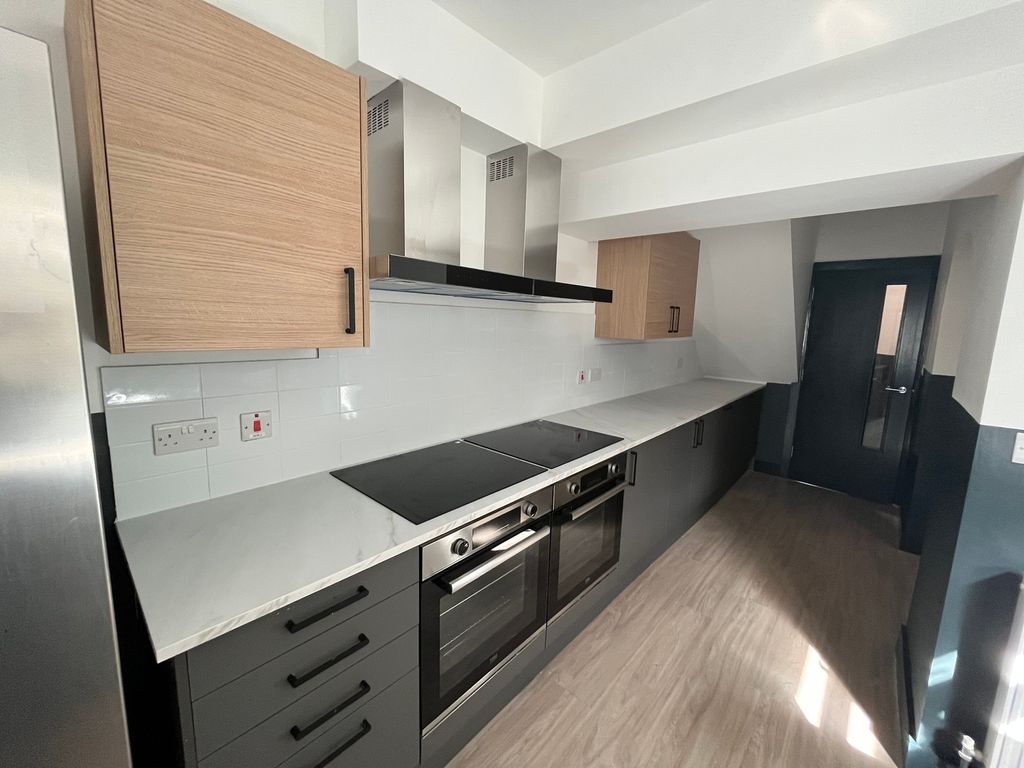 Property photo 2 of 9 A Modern And Spacious Kitchen Featuring Ample Stor...