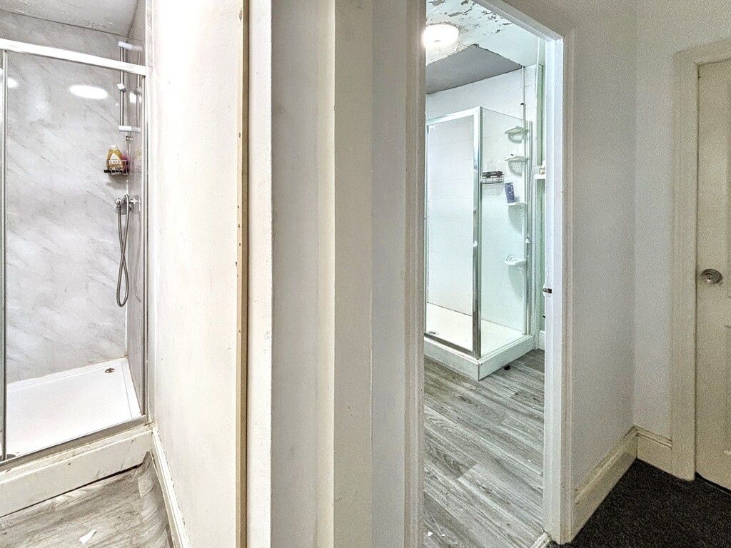 Property photo 2 of 5 A Clean And Well-Lit Spacious Bathroom With A Larg...