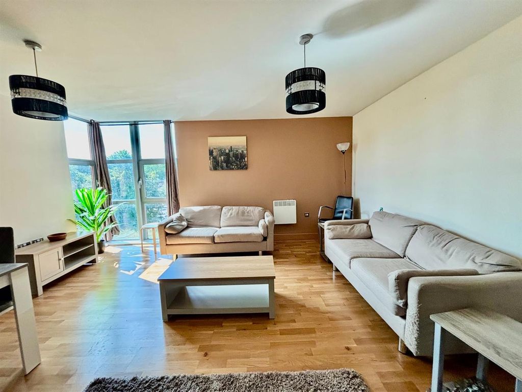 Property photo 3 of 12 Living / Dining Area:
