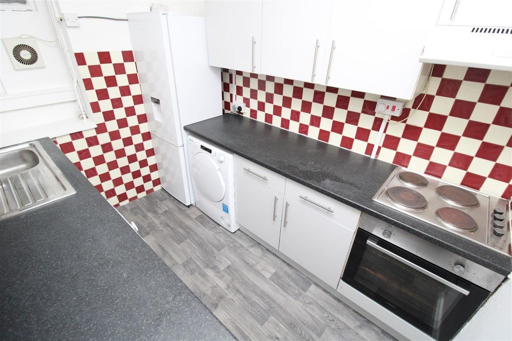 Property photo 3 of 6 Modern Kitchen With Ample Counter Space And Oven...