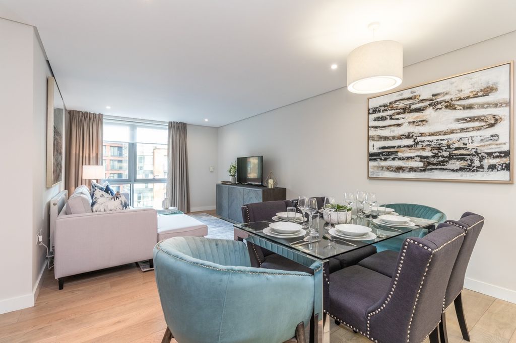 Property photo 2 of 13 This Stylish Living Room Boasts A Spacious Layout,...