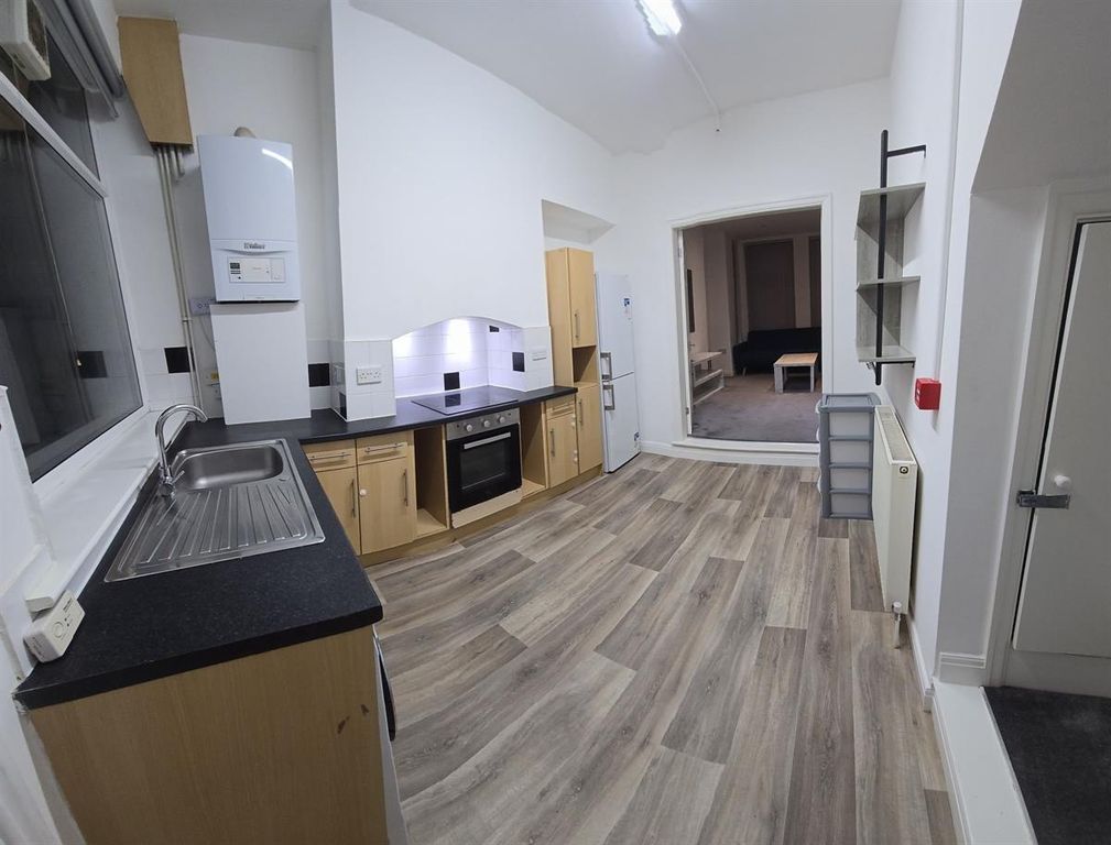 Property photo 3 of 10 Bright Kitchen With Ample Storage And Floor Space...