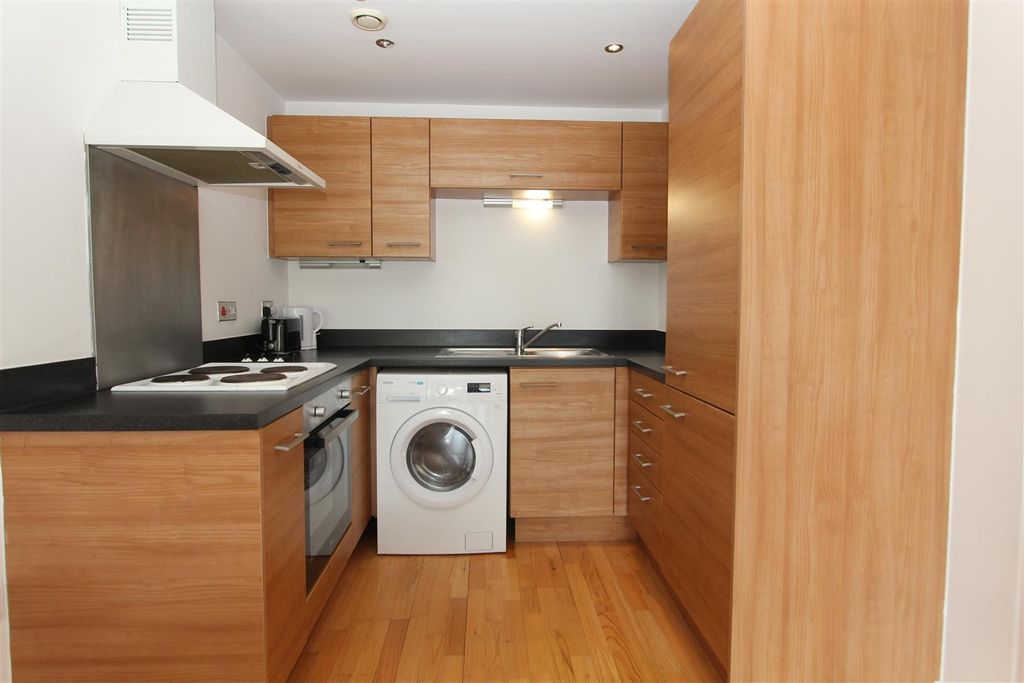 Property photo 3 of 7 Modern Kitchen With Wood Cabinetry And Appliances...