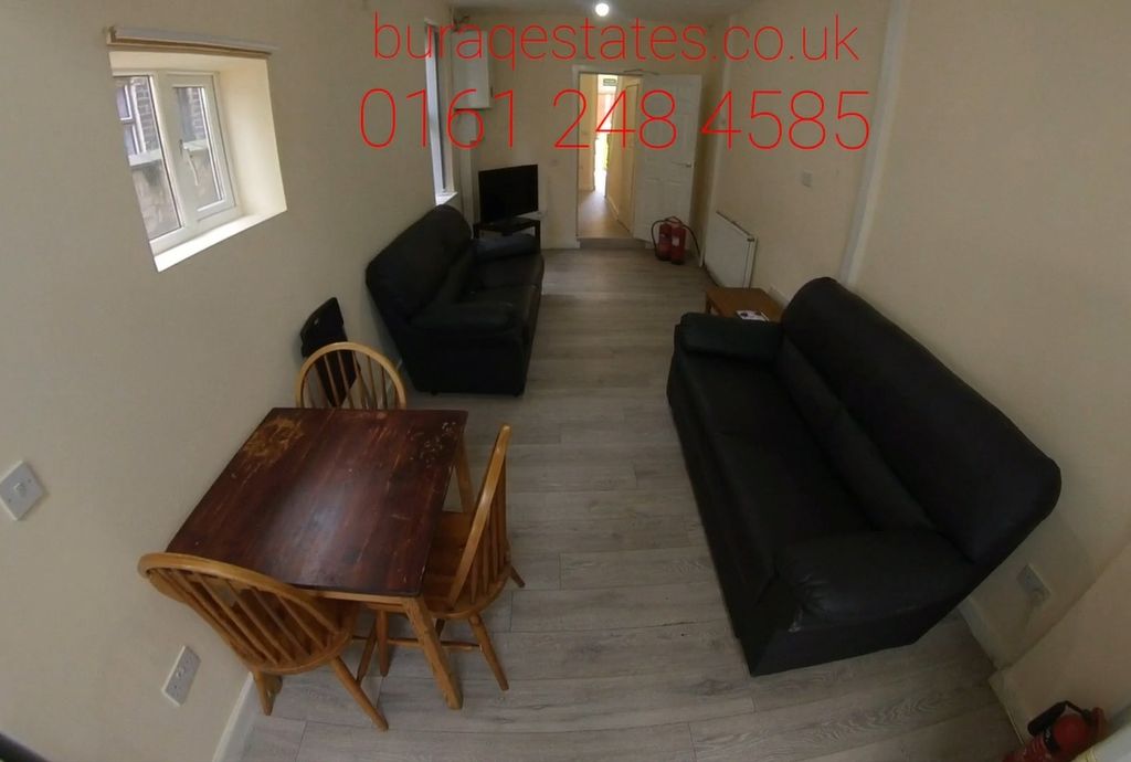 Property photo 3 of 13 A Well-Maintained Living Room Featuring A Comforta...