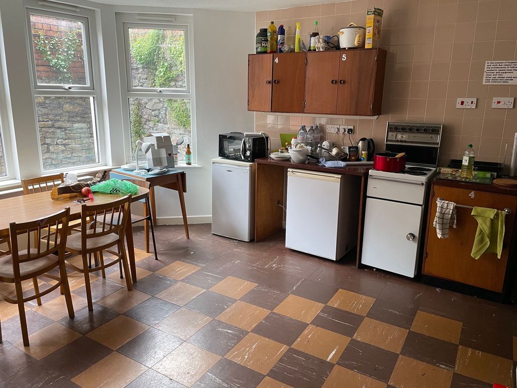 Property photo 3 of 6 A Cozy Kitchen Space Featuring Ample Counter Space...