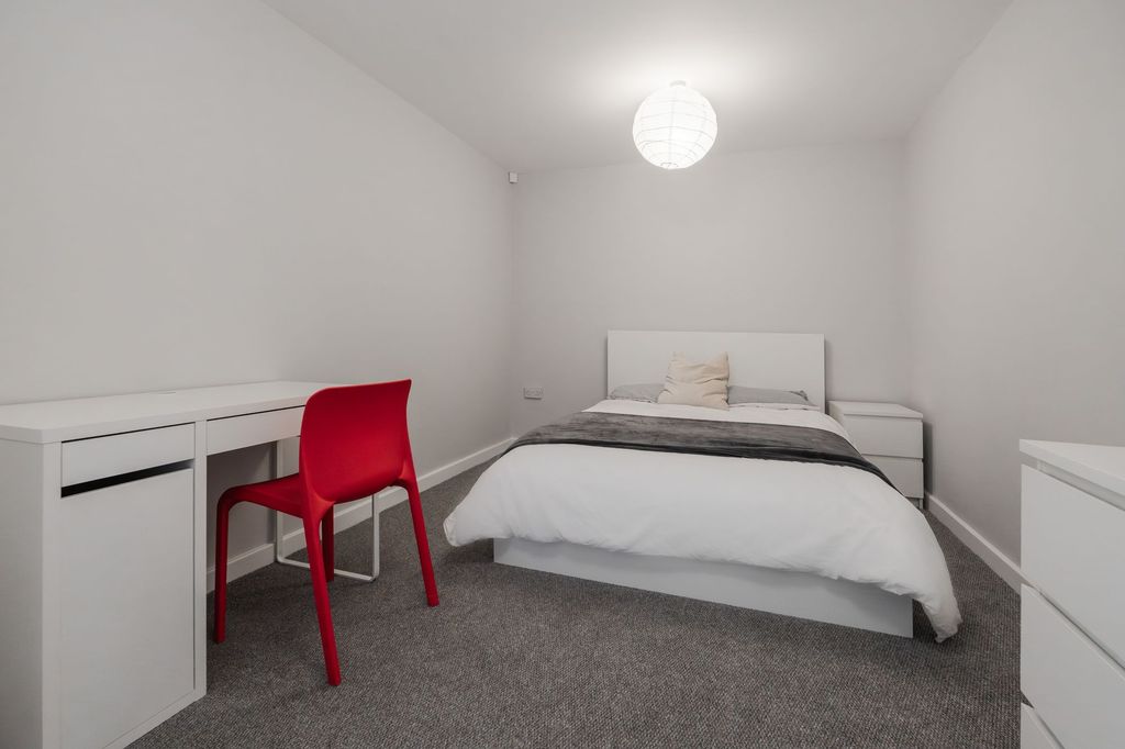 Property photo 3 of 9 A Clean, Minimalist Double Bedroom Featuring A Whi...