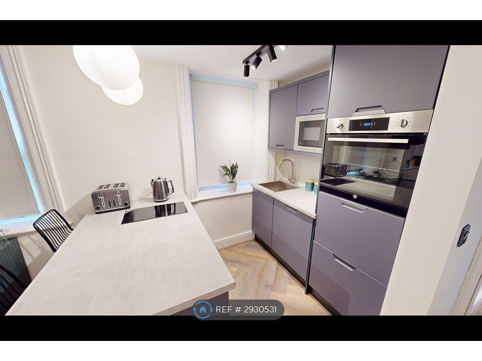 Property photo 1 of 8 Kitchen Area