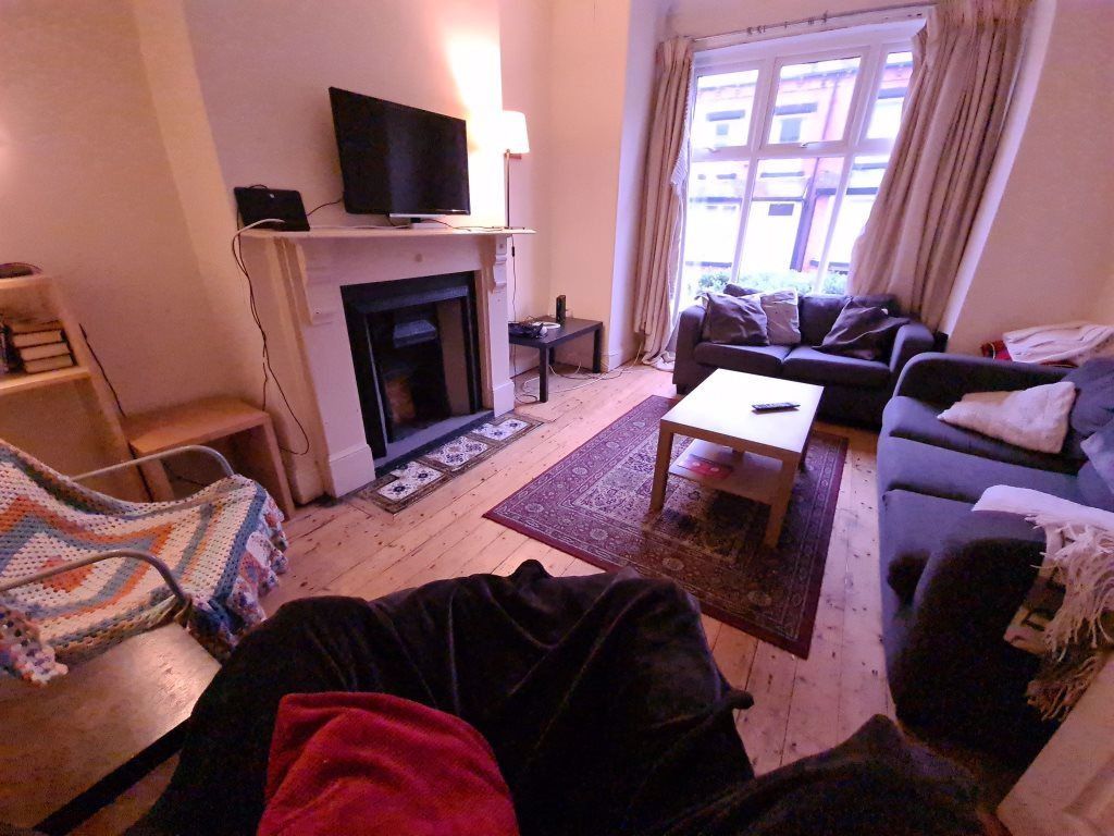 Property photo 2 of 15 A Cozy And Inviting Living Room With Comfortable S...