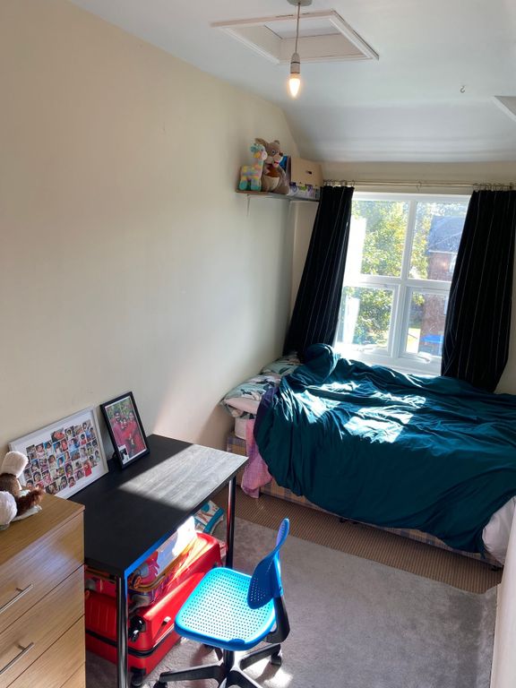 Property photo 3 of 5 A Bright And Cozy Bedroom Featuring A Double Bed, ...