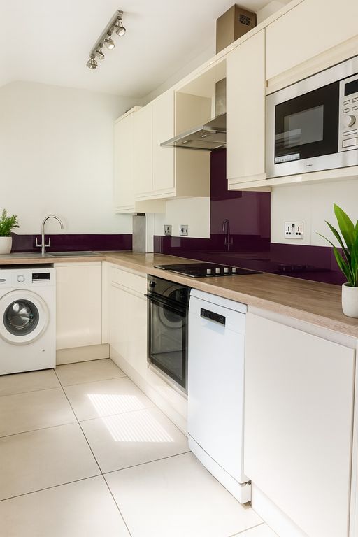 Property photo 1 of 7 Bright Modern Kitchen With Sleek Cream Cabinetry, ...