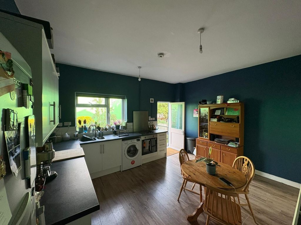 Property photo 1 of 7 A Cozy Kitchen With Dark Teal Walls, Modern White ...